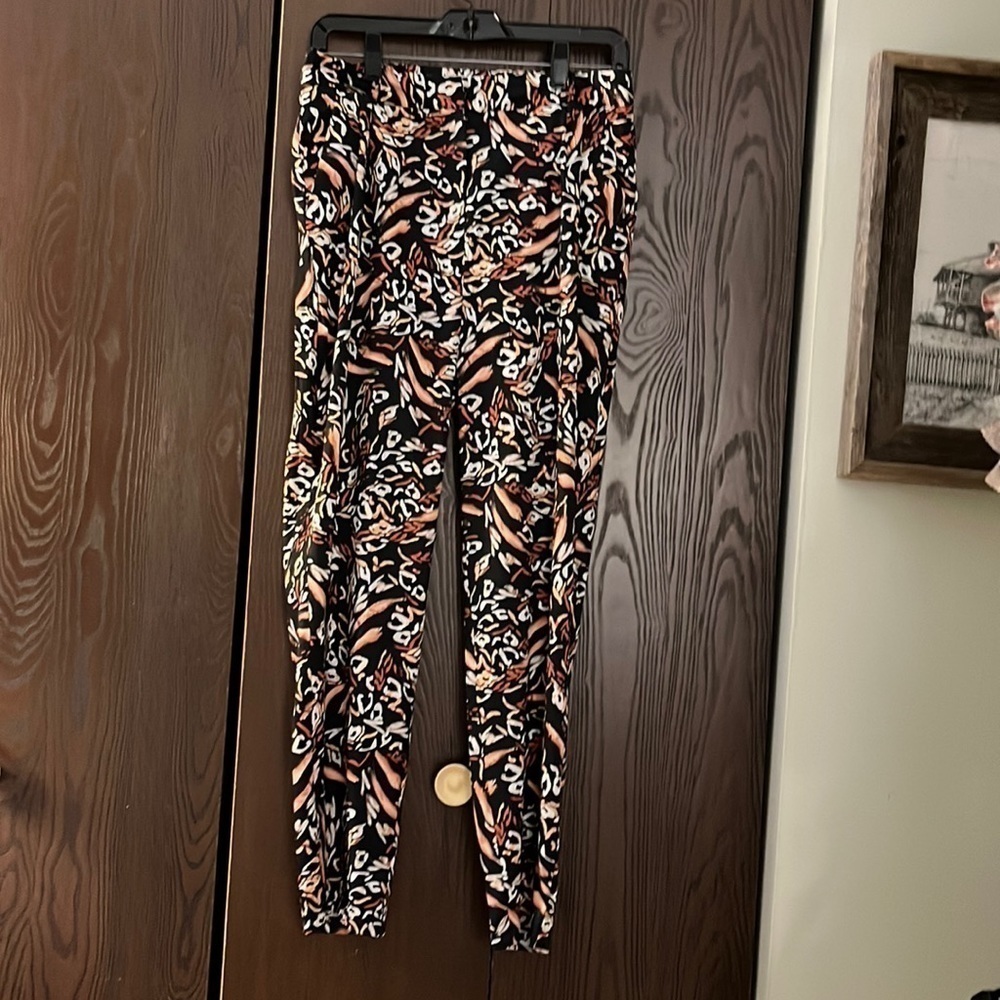 Molly Bracken 100% polyester animal print pants. Size S/M silky feel. NWOT